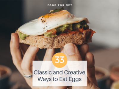 A pair of hands holding up a fried egg on toast