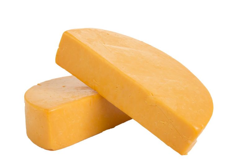 Colby cheese wheels against a white background | Food For Net Colby cheese wheels against a white background