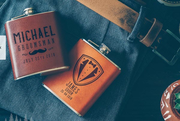 Combination-Of-Leather-Flasks | Food For Net Two leather flasks on a pair of shorts.