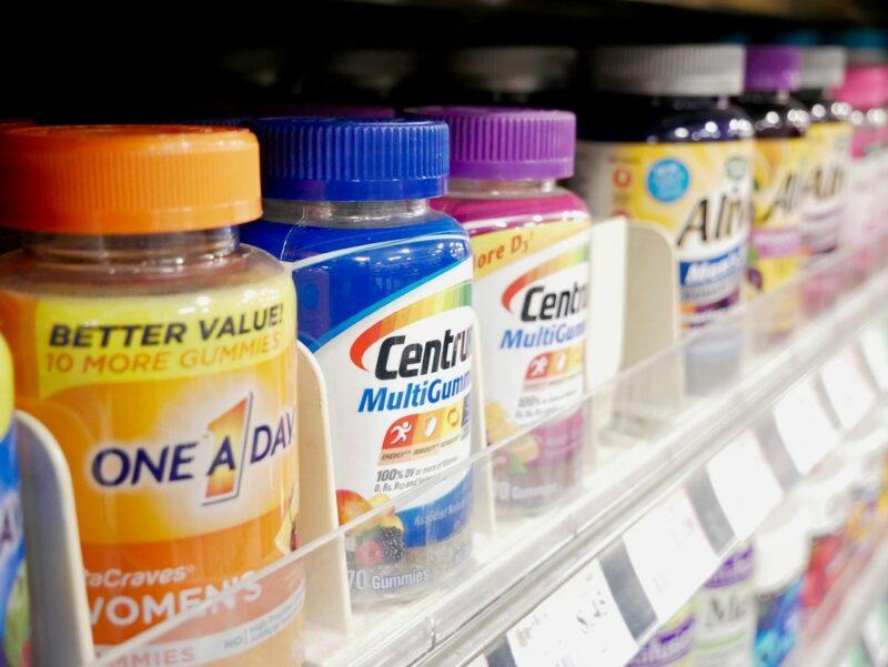 A selection of commercial multivitamins in a grocery store