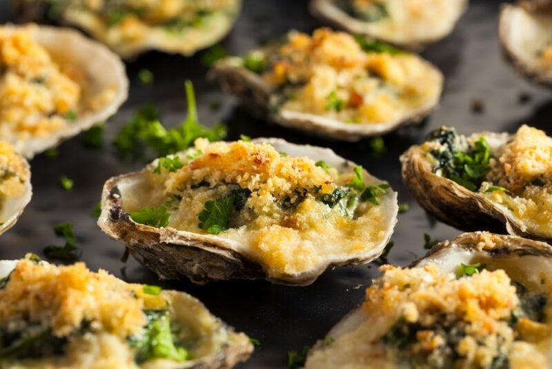 Cooked oysters that have been stuffed with breadcrumbs and other ingredients