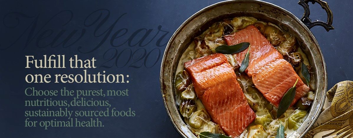 Cooked-salmon-1 | Food For Net A two handled antique pan with cooked salmon sitting a artichokes in a cream topped with fresh sage leaves. Right corner is a damask tan napkin with gold plated forks on top.
Background is midnight with darker blue font stating New Year 2020
Below that in beige font it states Fulfill that one resolution:
Green font, states Choose the purest, most nutritious, delicious, sustainably sourced foods for optimal health