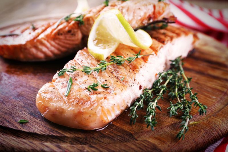 Baked salmon on a wooden board