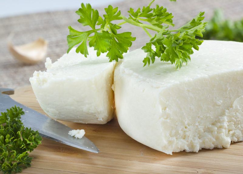 Cotija cheese on a cutting board