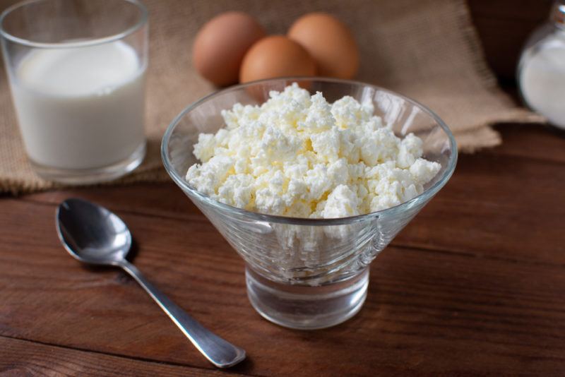 A glass bowl containing fresh cottage cheese