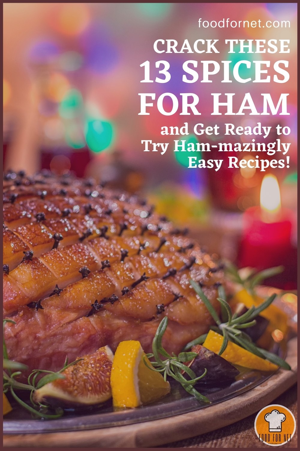 Spices for Ham. closeup image of a beautifully plated ham with roasted vegetable, citrus, and rosemary, with glass of drinks and red candle at the back; with text overlay "Crack These 13 Spices for Ham and Get Ready to Try Ham-mazingly Easy Recipes!"