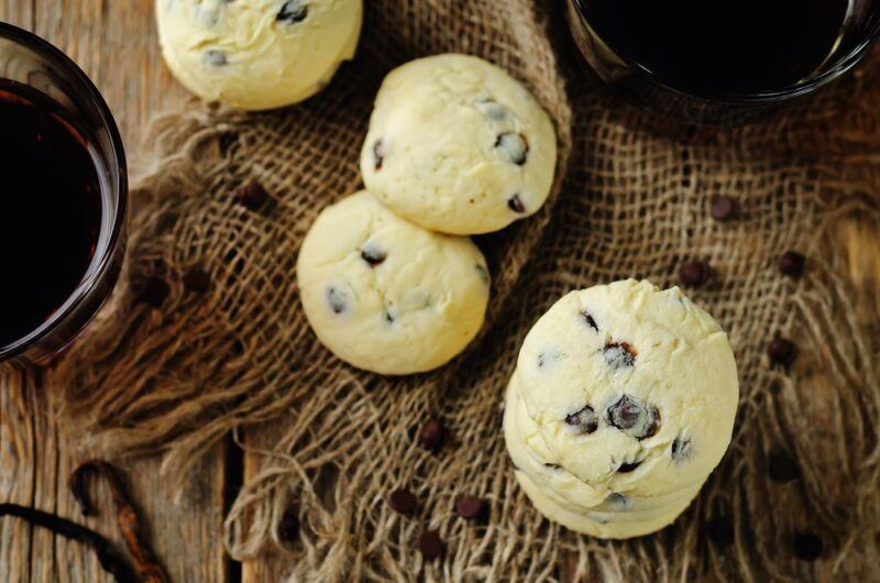 A burlap sack with four cream cheese chocolate chip cookies