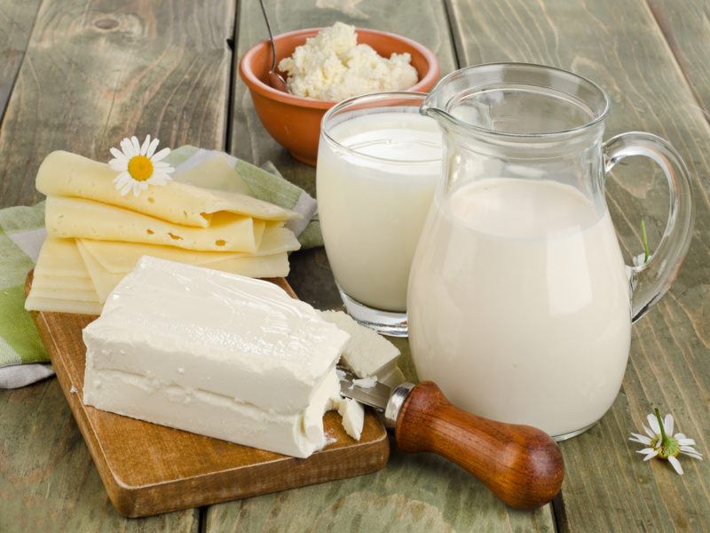 A selection of dairy products, including cheese and milk