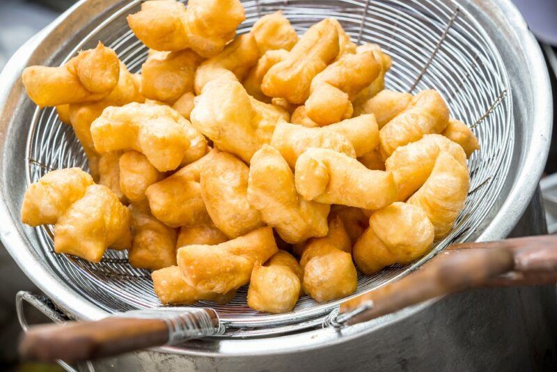 A mesh basket that contains deep fried butter, which might be served at a fair