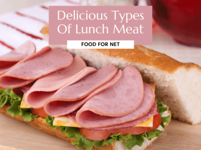 A large lunch roll with lunch meat, cheese, and greens, looking at the different types of lunch meat