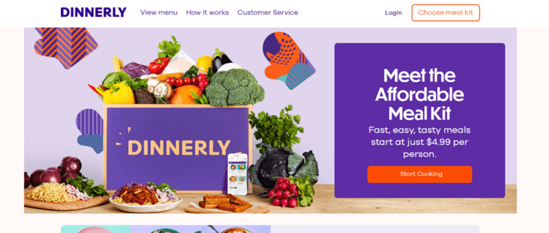 A screenshot of the Dinnerly website, showing a purple box with plenty of fresh ingredients, next to information about affordable meal kits and the price per serving