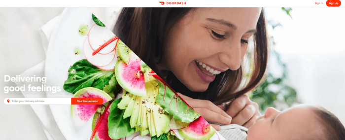 Young woman with a baby and a fresh salad