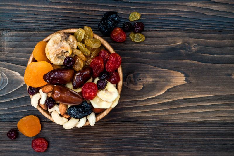 A bowl of dried fruit on a table