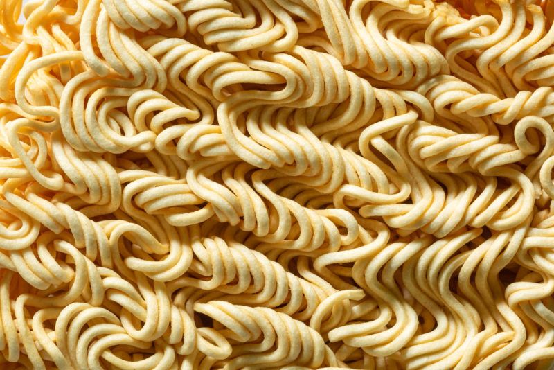 A macro image of dried ramen noodles