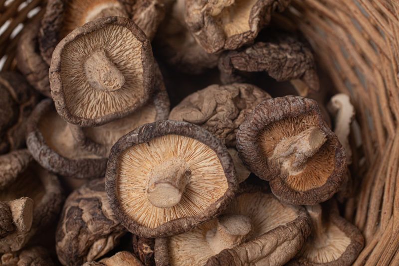 A box or basket filled with dried shiitake mushrooms