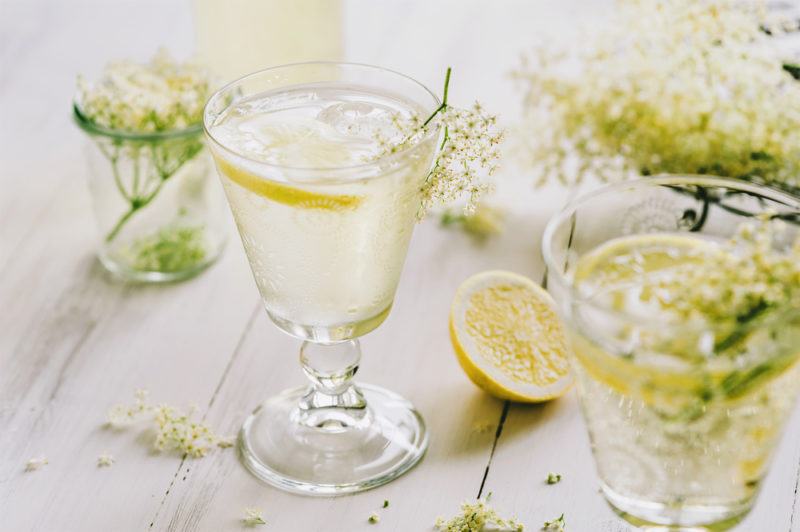 Multiple glasses of elderflower gin and tonic