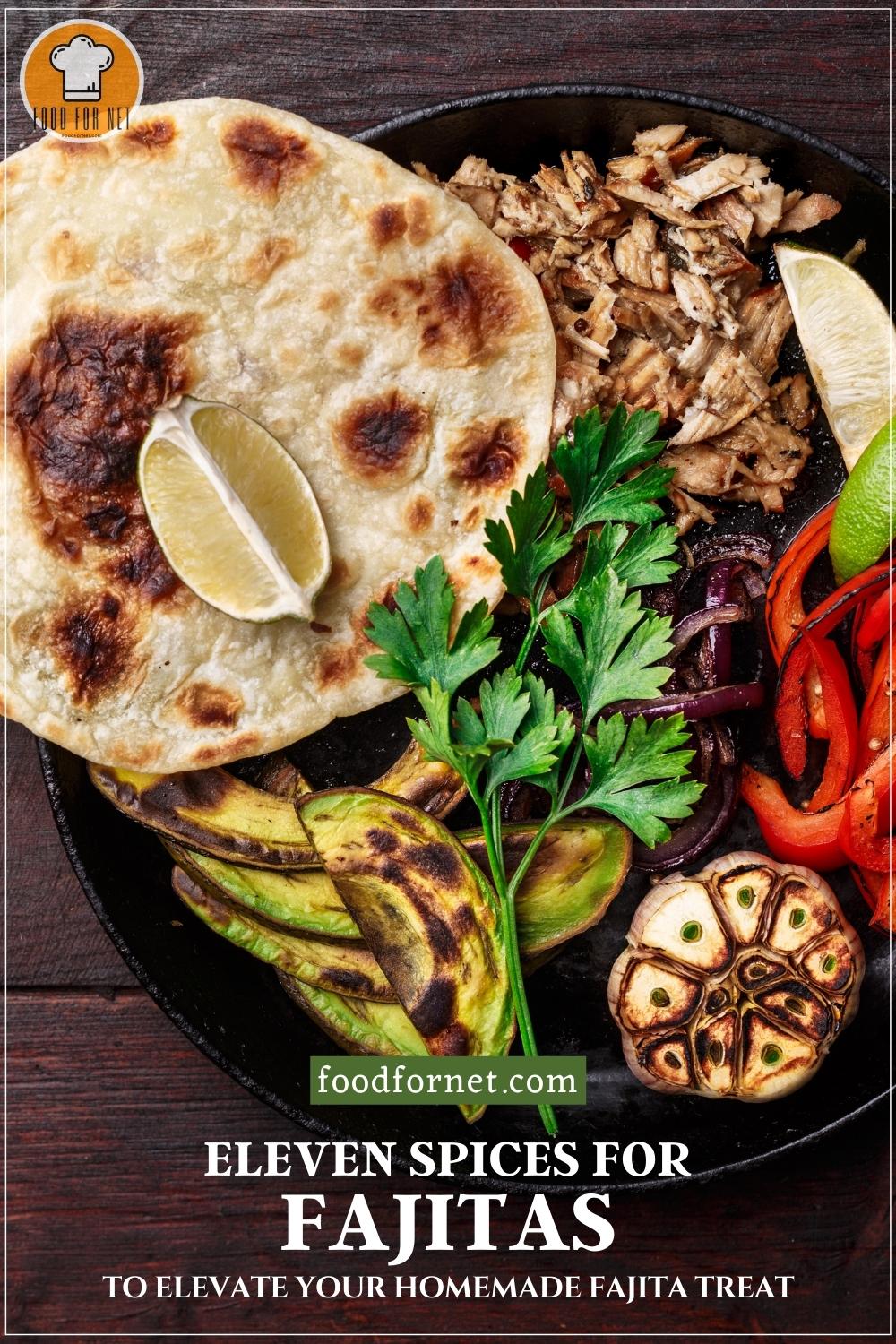 Spices for Fajitas. overhead shot of a cast iron pan on a dark wooden surface with tortillas, wedge of lime, slices of grilled meat, red peppers, red onions, avocados, and a garlic head, and a sprig of fresh cilantro; with text overlay "Eleven Spices for Fajitas to Elevate Your Homemade Fajita Treat"