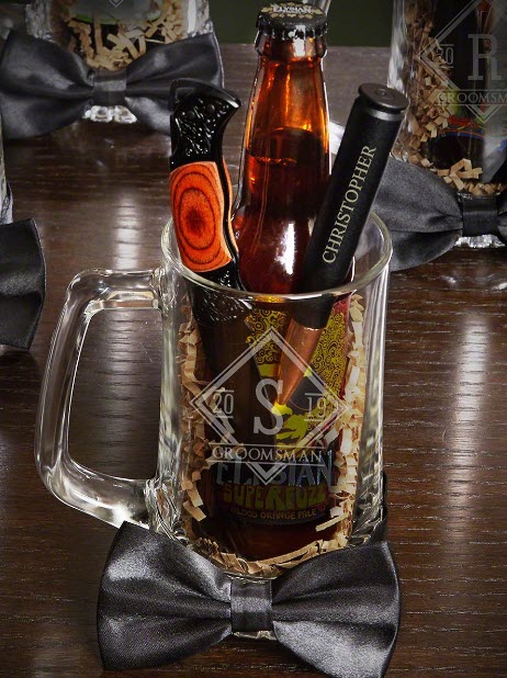 Beer glass with a bow tie, beer, a bullet bottle opener and a knife