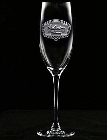 Engraved Champagne Toasting Glass | Food For Net Etched champagne glass against a black background.
