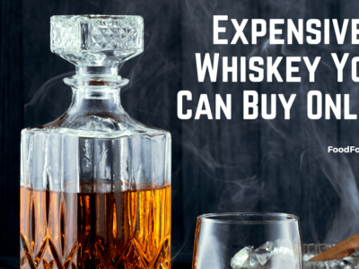 A decanter of whiskey, a whiskey glass and a cigar