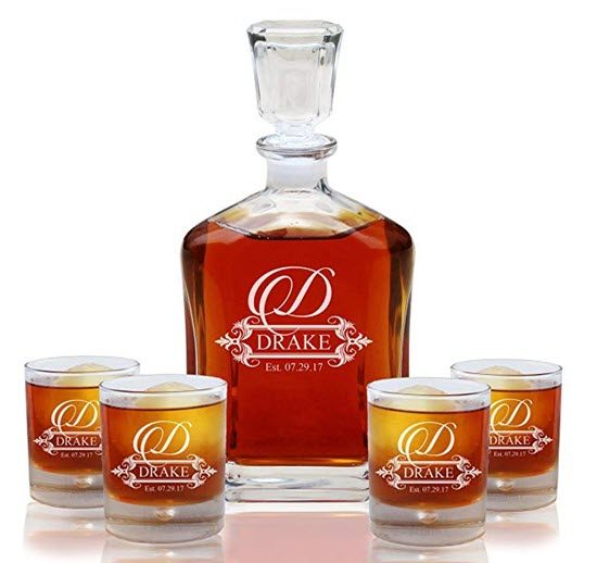 Fancy Design Whiskey Decanter Set | Food For Net A whiskey decanter and four glasses, all engraved with a D and Drake