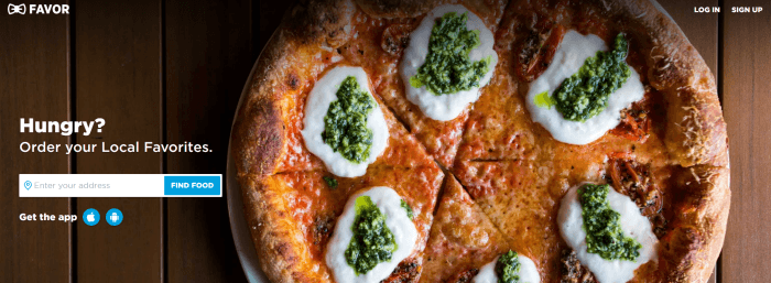 A pizza with sour cream and basil pesto