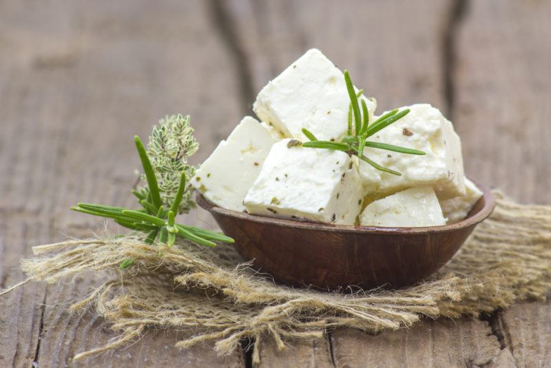 A brown bowl of feta