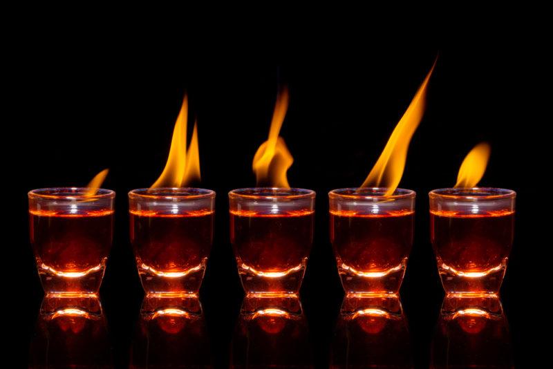 Five shots on a black background that has been set on fire