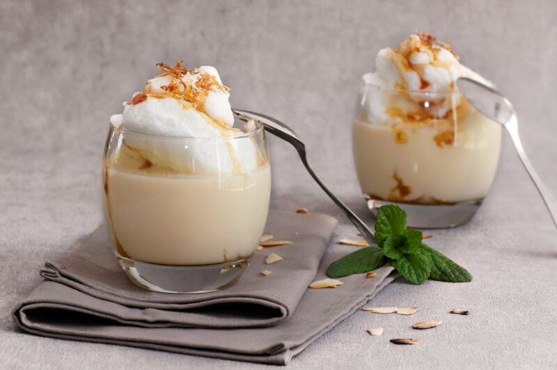 Two glasses containing a French dessert known as a floating island