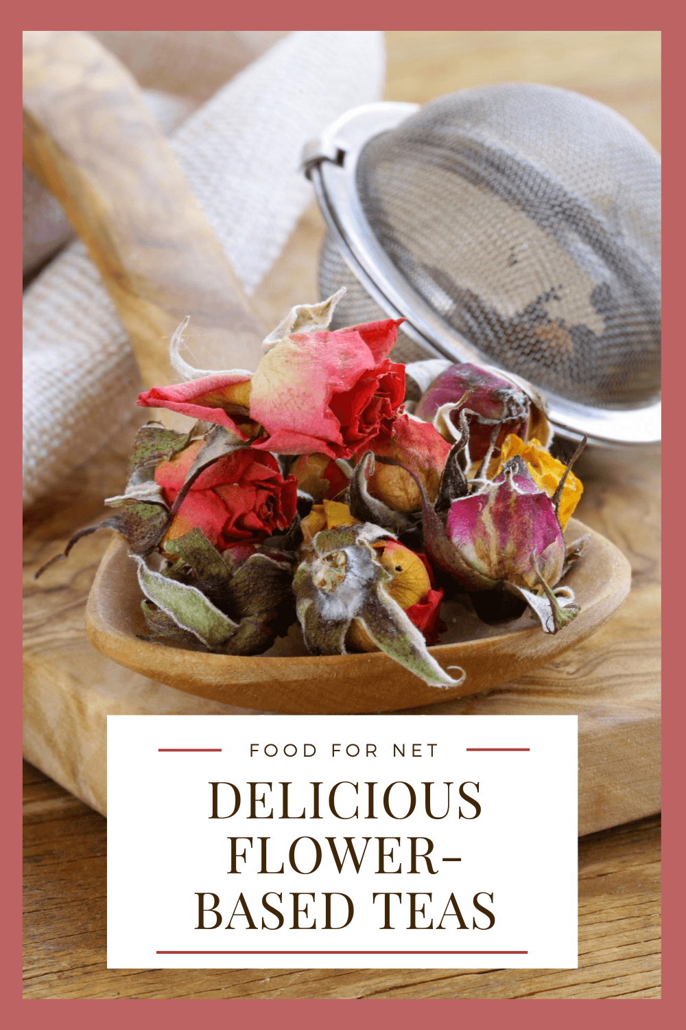 A wooden spoon with a selection of dried flower buds to make floral tea