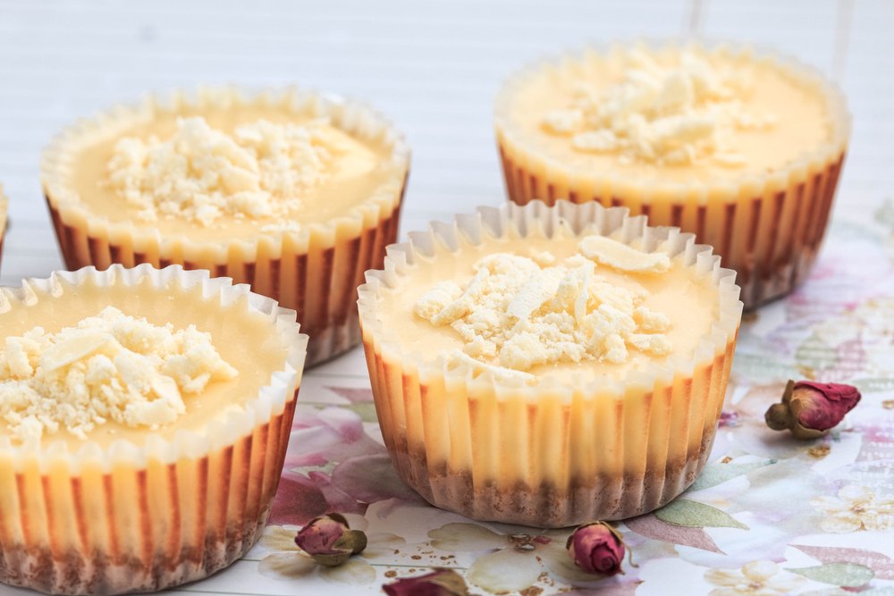 Four mini keto cheesecakes on a table