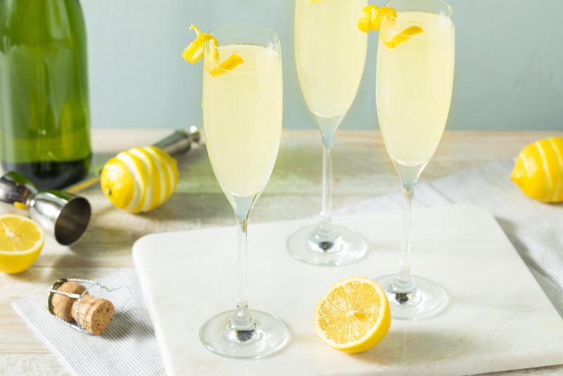 Three French 75 cocktails on a white tray