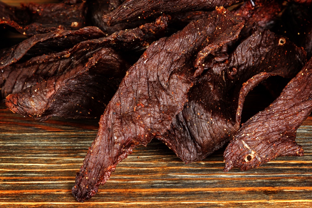 Fresh homemade jerky on a wooden board