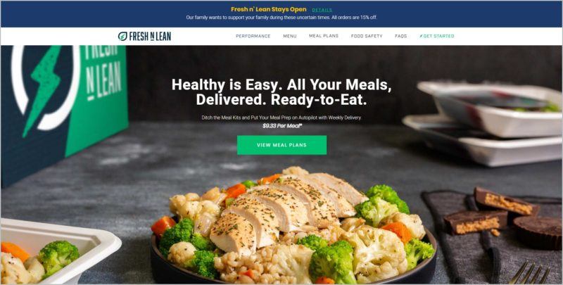 screenshot of Fresh n’ Lean homepage, with a closeup image of a beautifully plated dish with a 'view meal plans' button at the center