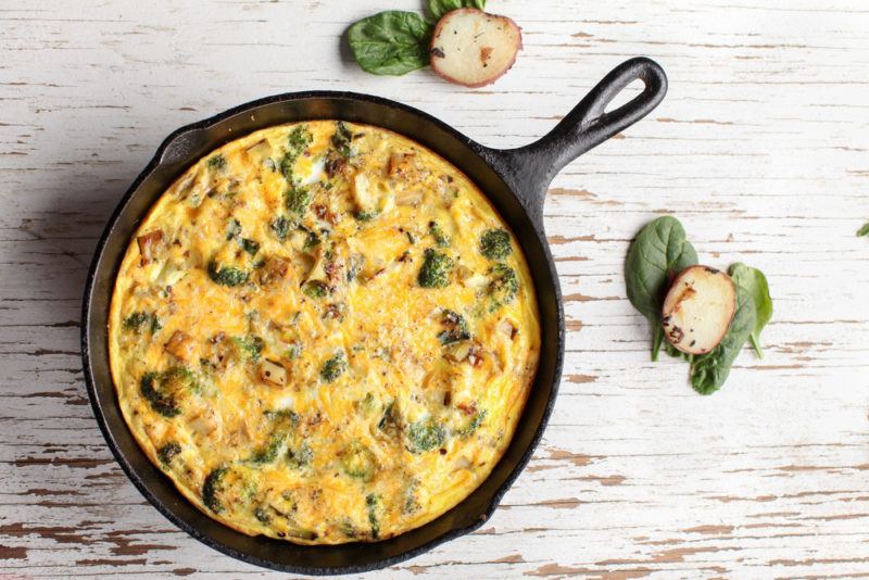 A fully cooked frittata in a cast iron pan