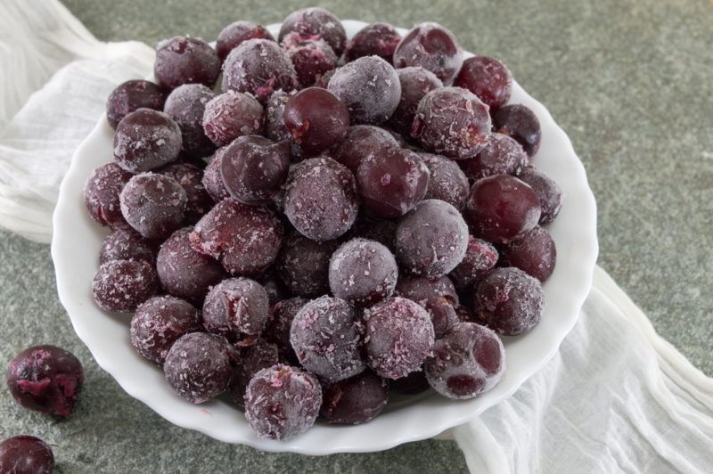 A bowl of frozen grapes