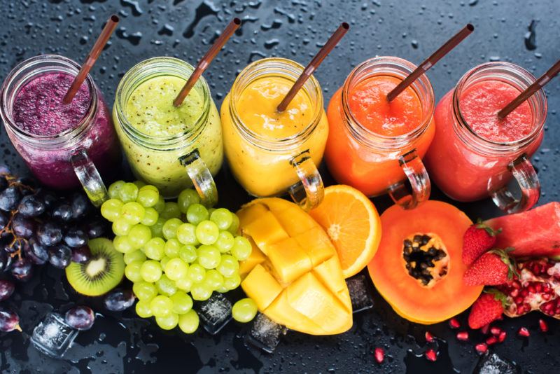 A rainbow selection of fruit smoothies