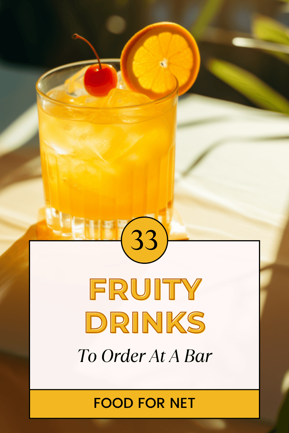 A single orange cocktail sitting on a table, highlighting the idea of fruity drinks to order at a bar