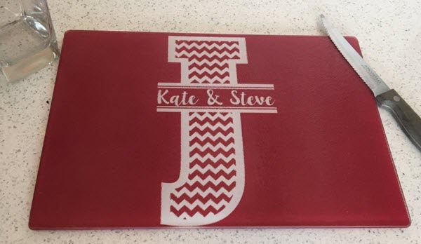 Full-Color-Chevron-Cutting-Board | Food For Net Red cutting board with a large white 'J' and the words Kate & Steve