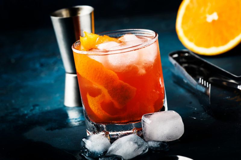 A cocktail glass with an orange Garibaldi cocktail