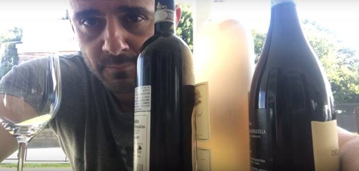 GaryVee’s Monthly Wine Club | Food For Net Gary behind 3 bottles of wine and a wine glass