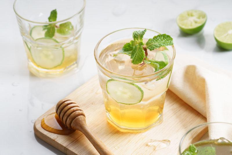 Two glasses of iced tea with honey and gin