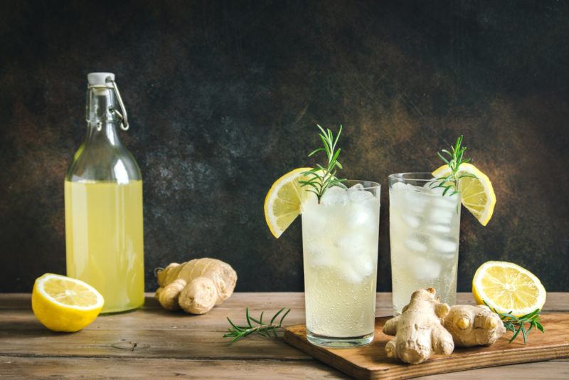 A bottle of ginger beer and two glasses