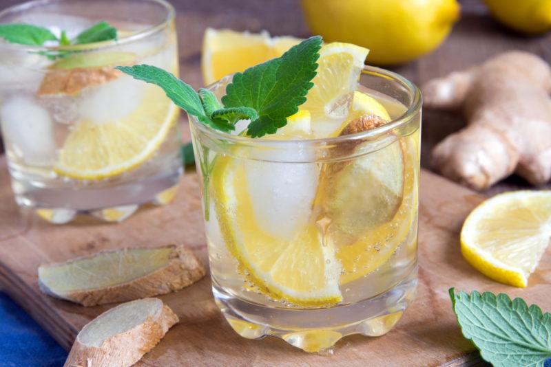 Two glasses of a ginger rogers cocktail with lemon