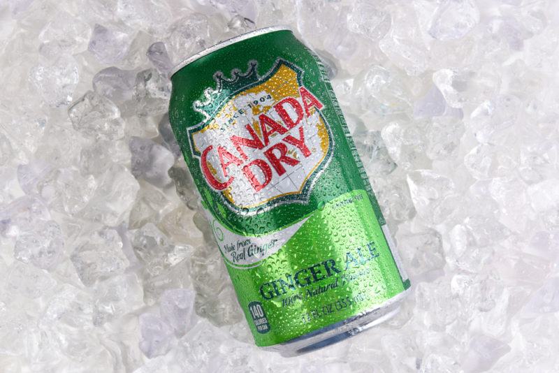 A can of Canada Dry ginger ale on a bed of ice