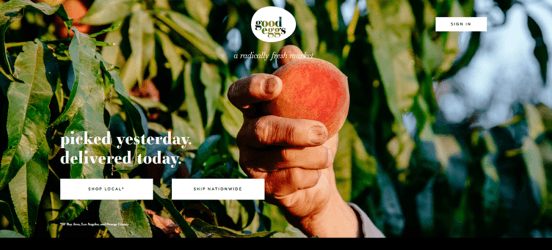 A website screenshot from Good Eggs, showing someone holding up an apple or peach