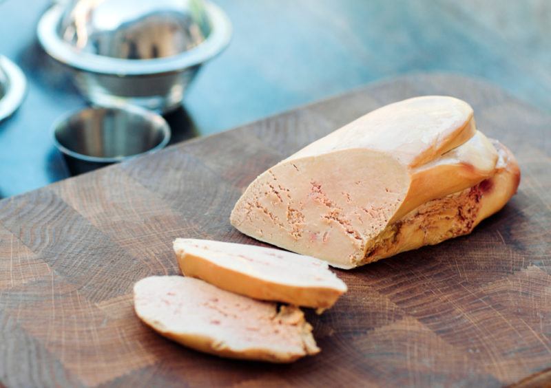 Goose liver that has been sliced and laid upon a table