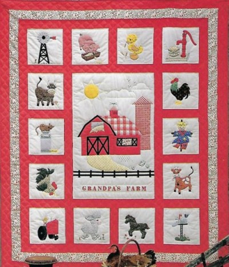 Grandpa's Farm quilt with red background and different farm themed blocks