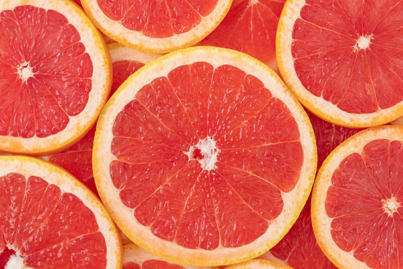 This photo shows several slices of ruby red grapefruit.