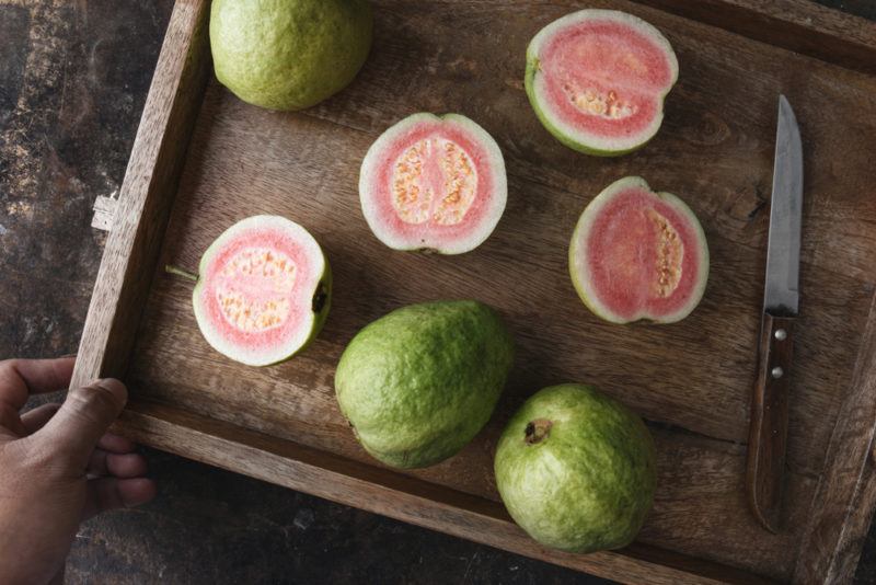 Three whole guavas with four halves